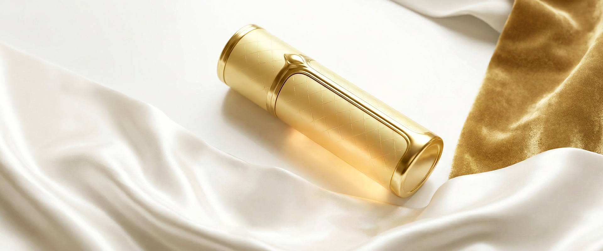 GOOD TEC gold perfume atomizer on white silk
