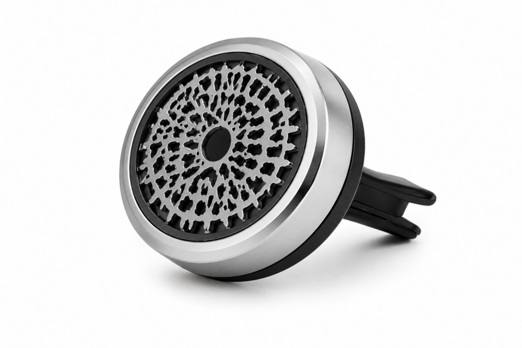 Round silver car diffuser with a black air vent clip