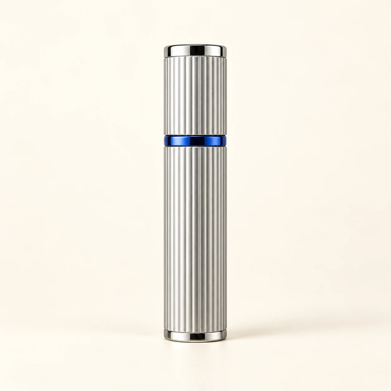 Complete fluted silver travel perfume atomizer concept with cobalt-blue accent ring