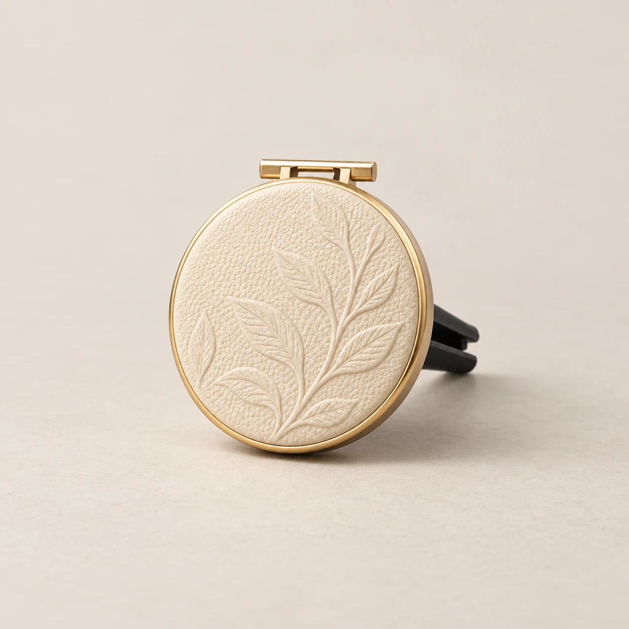 Complete ivory round car diffuser design concept with botanical relief and rear vent clip