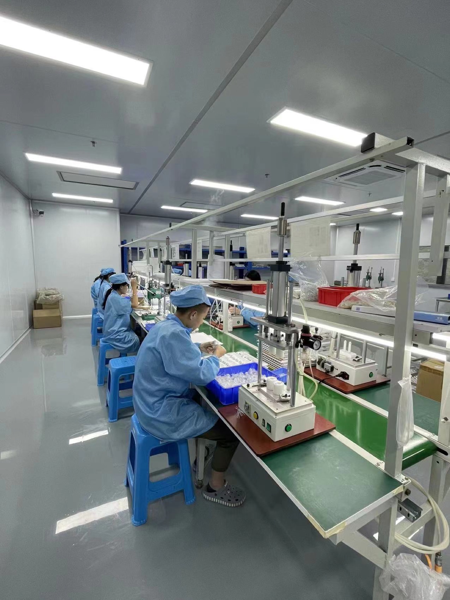 Operators at the GOOD TEC atomizer assembly workstations