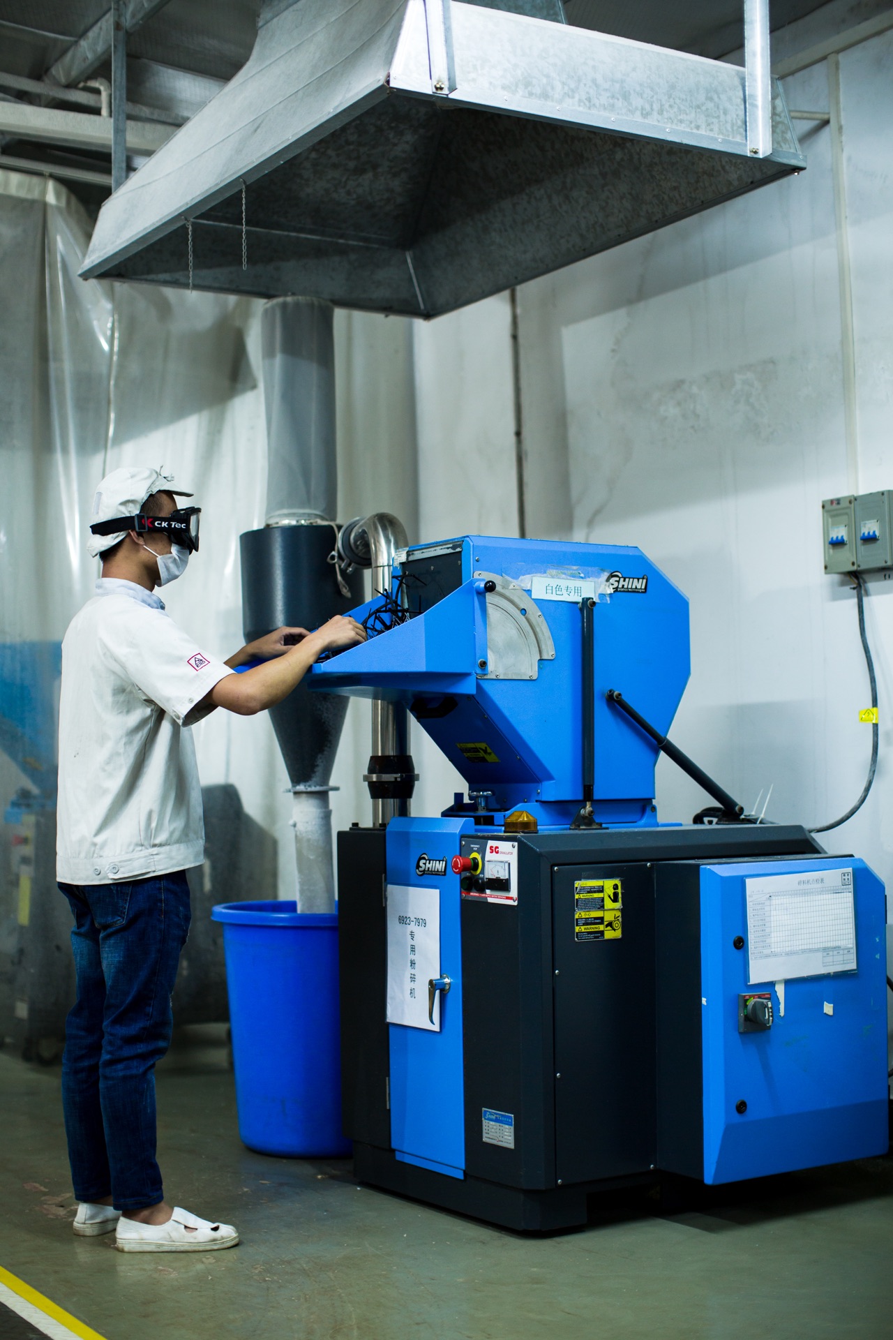 Operator working with material processing equipment