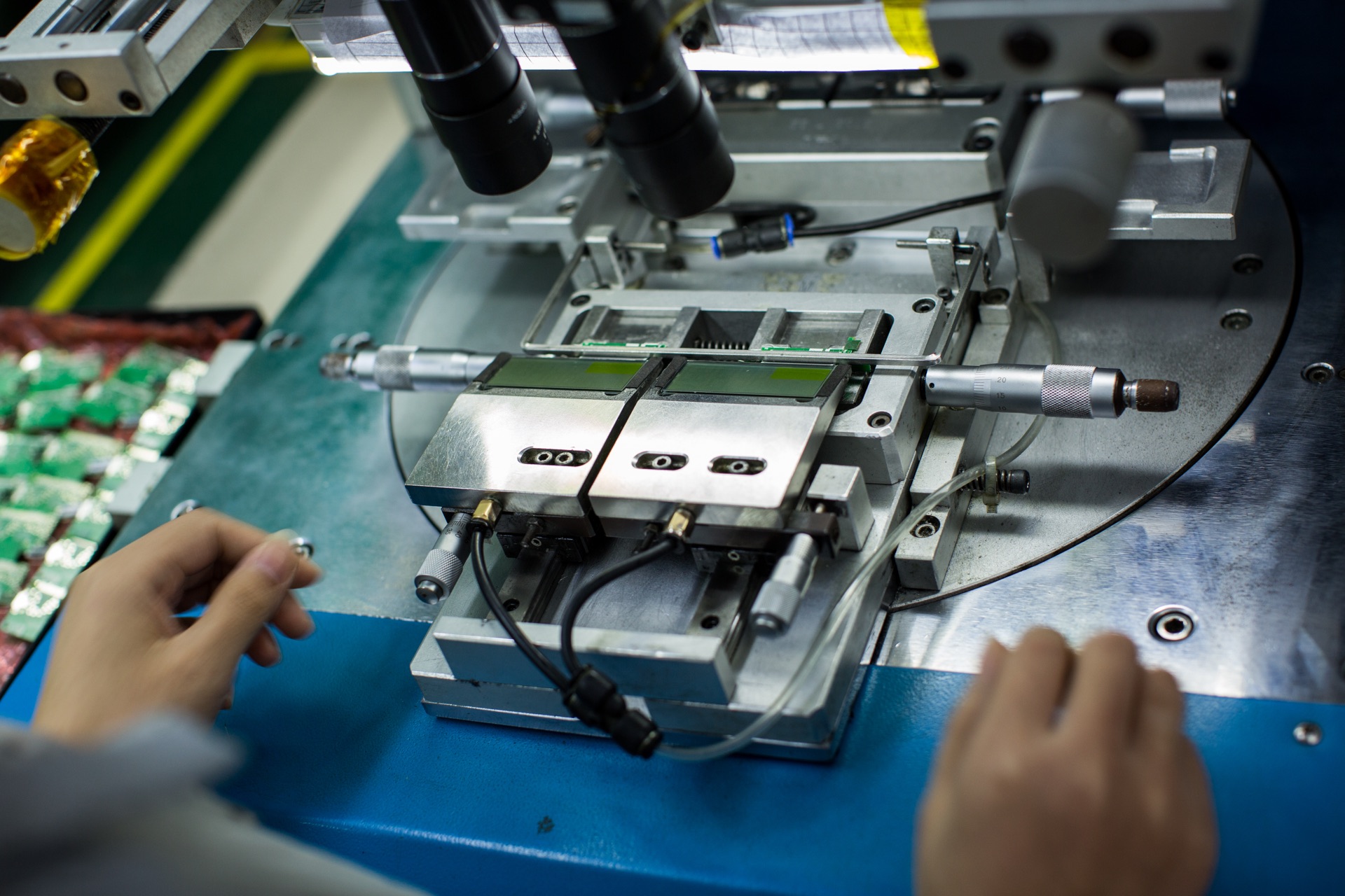 Close-up of a precision workstation with optical equipment and positioning fixtures