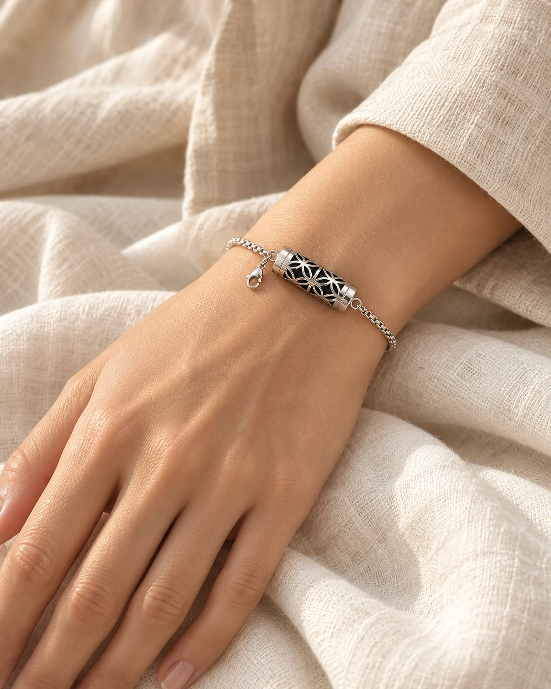 Illustrative wearing scene of an openwork silver aroma bracelet on a wrist