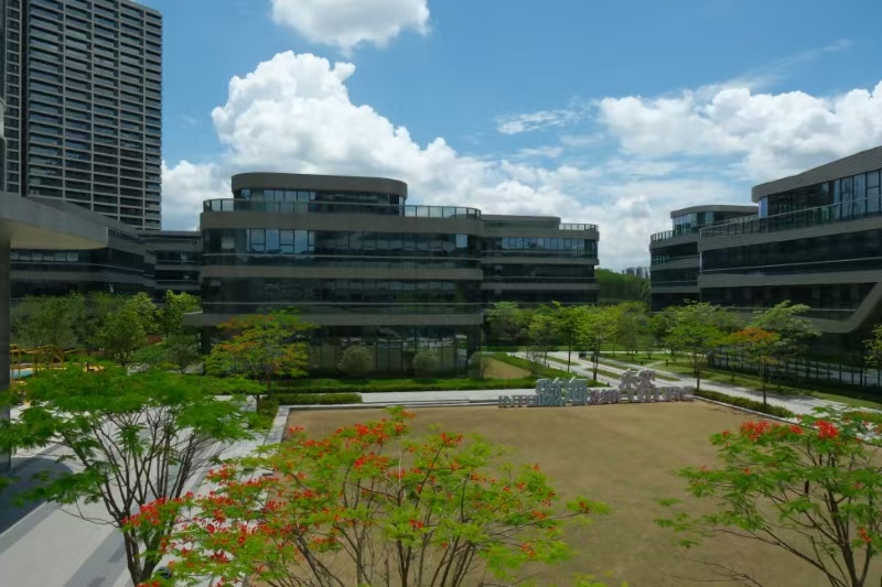 Building exterior and landscaped entrance at the company campus